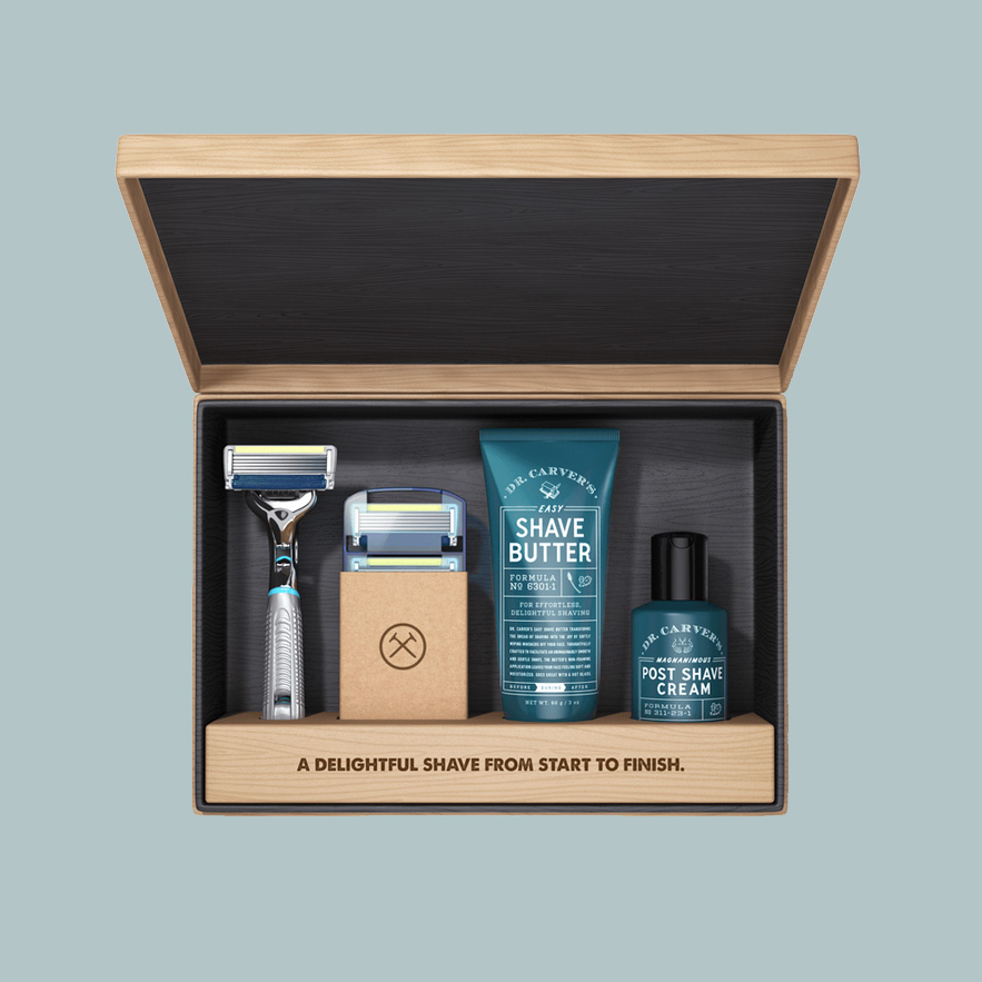 Image of Dollar Shave Club wooden box with shaving products inside